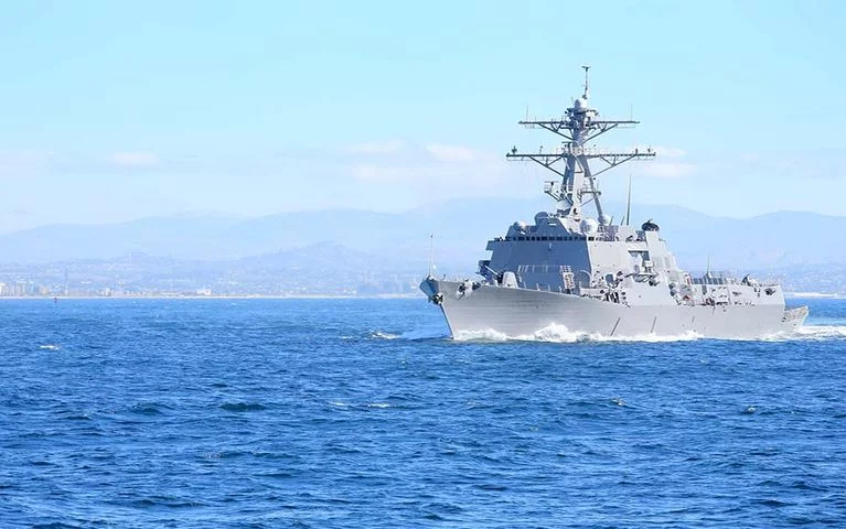 A powder coating ship sailing in the sea under clear blue sky