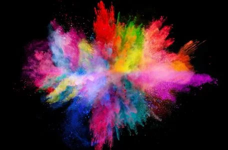 Powder explosion creating a colorful powder cloud