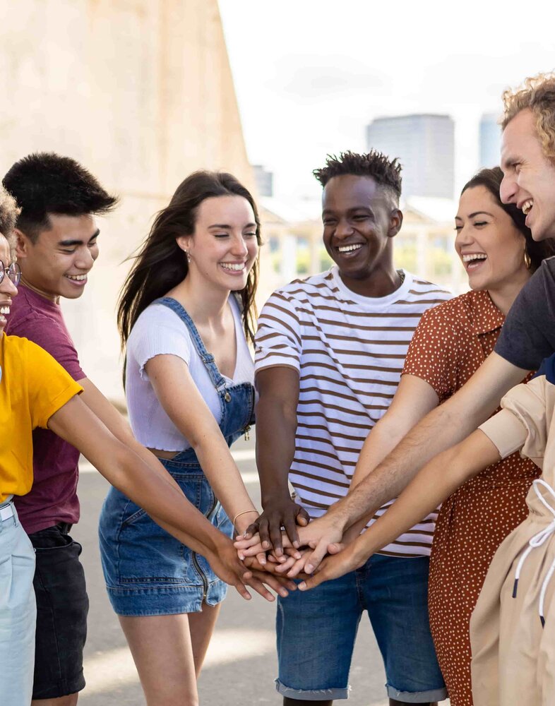 group-of-young-student-friends-with-hands-on-stack-2022-04-26-04-00-48-utc.jpg
