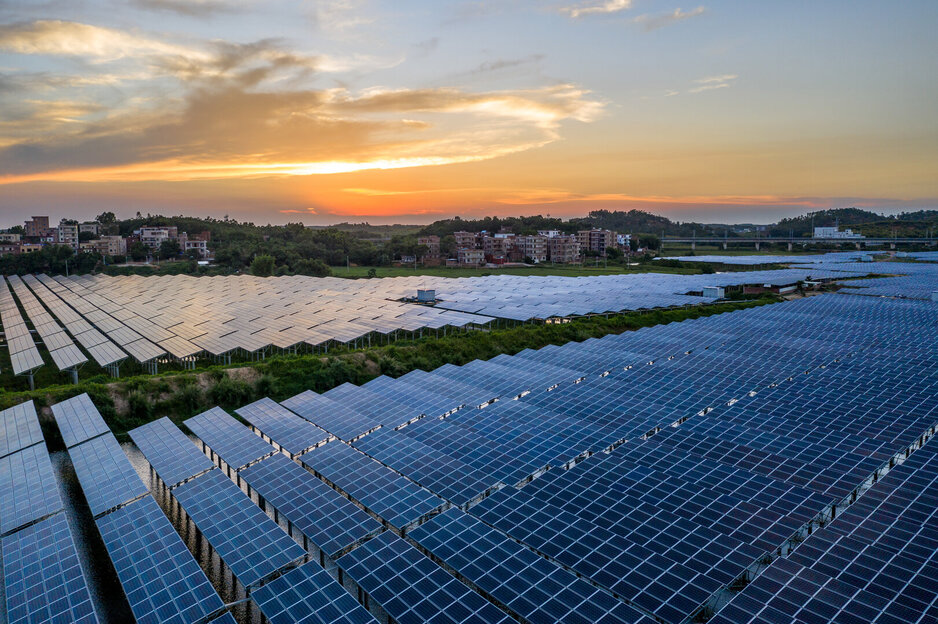 A solar power plant in a beautiful sunset